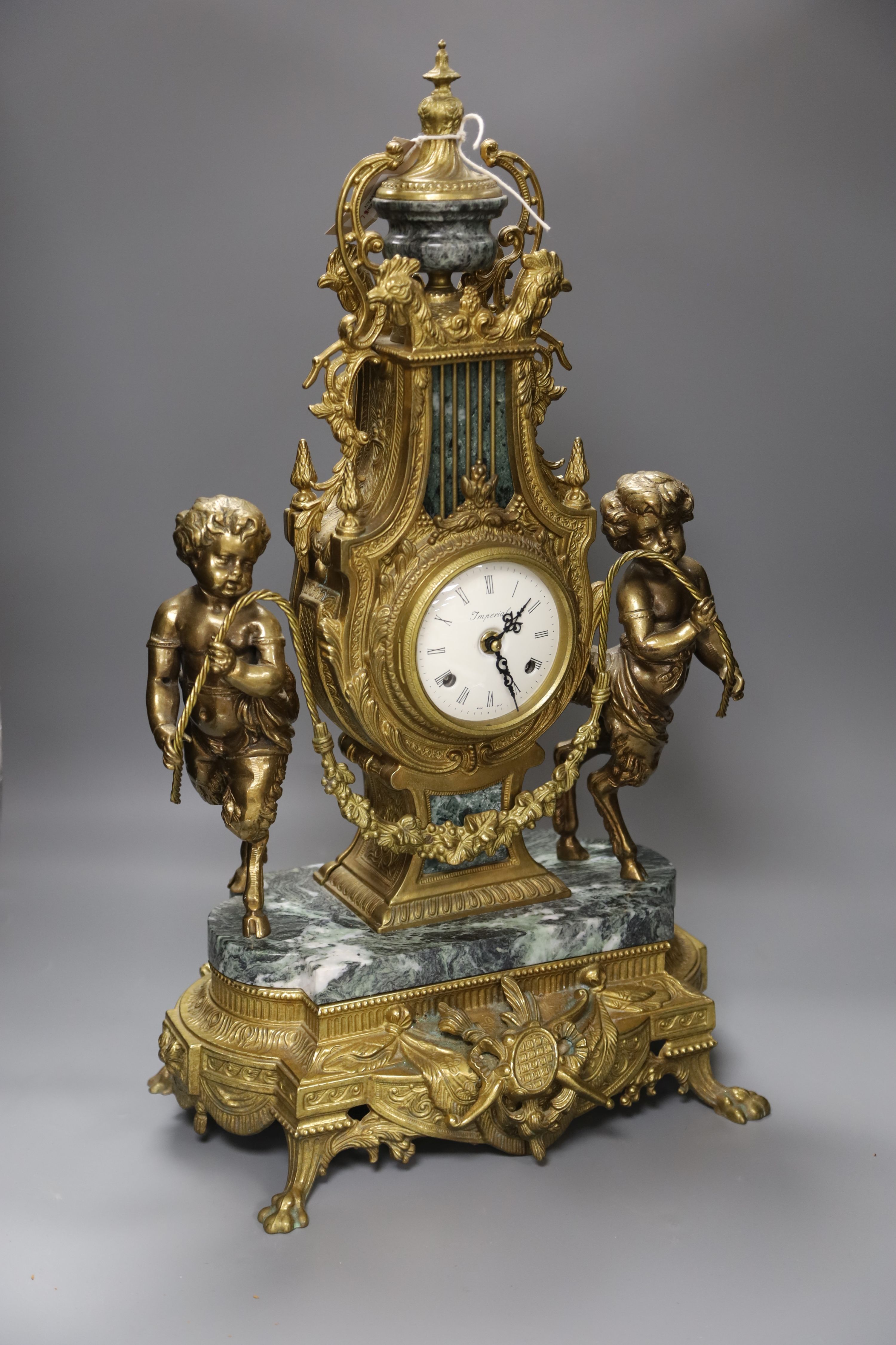 A Louis XVI style ormolu and variegated green marble mantel clock, H approx 60cm